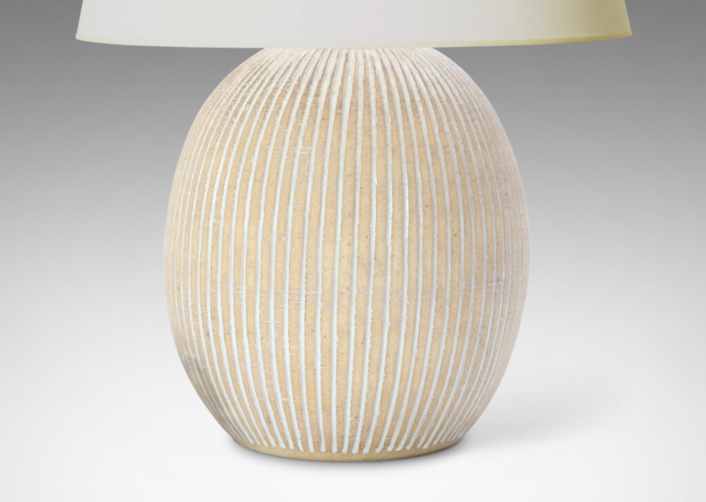 Gallery BAC light tan ovoid form with carved and white-glazed vertical pinstripes