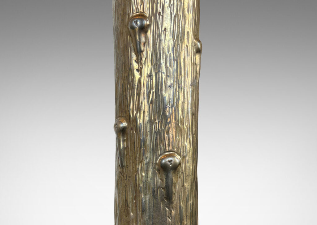 Gallery BAC columnar form with flared top and base, featuring a hand-hammered repoussé organically modeled texture; brass