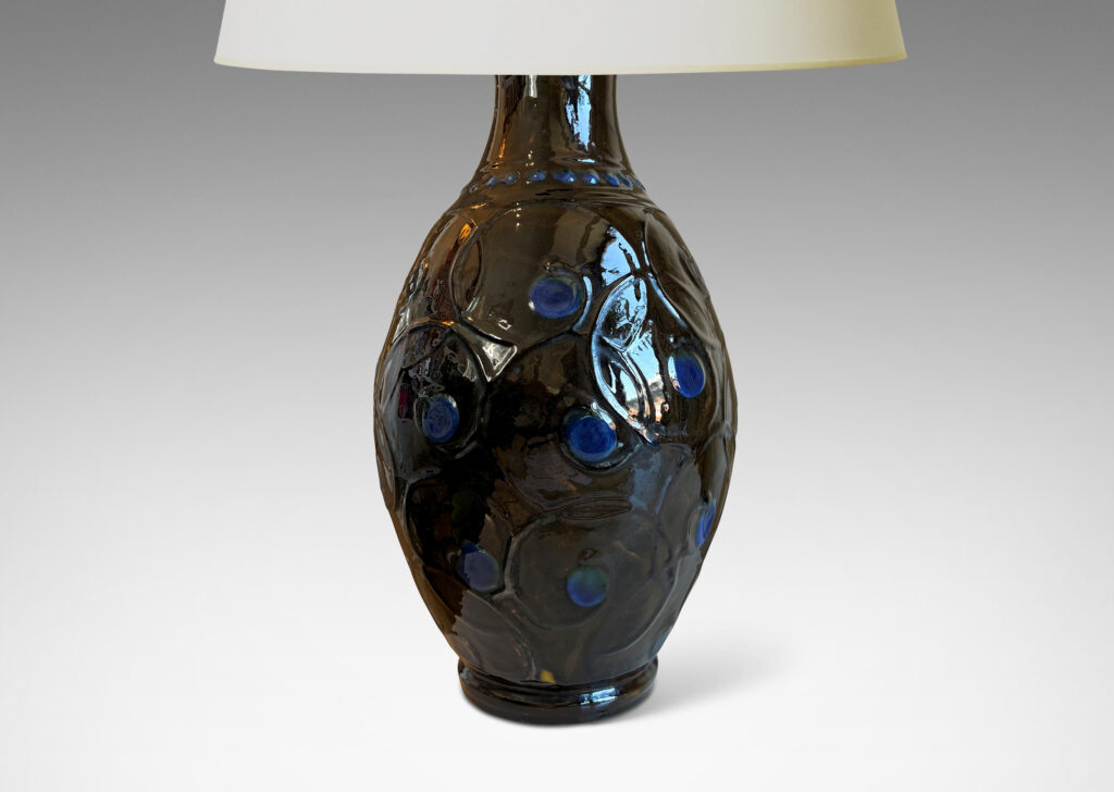 Gallery BAC swelling form with slip relief scrolling design, glazed in ganache brown with blue dot accents