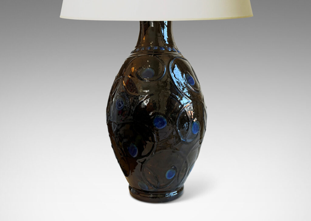 Gallery BAC swelling form with slip relief scrolling design, glazed in ganache brown with blue dot accents