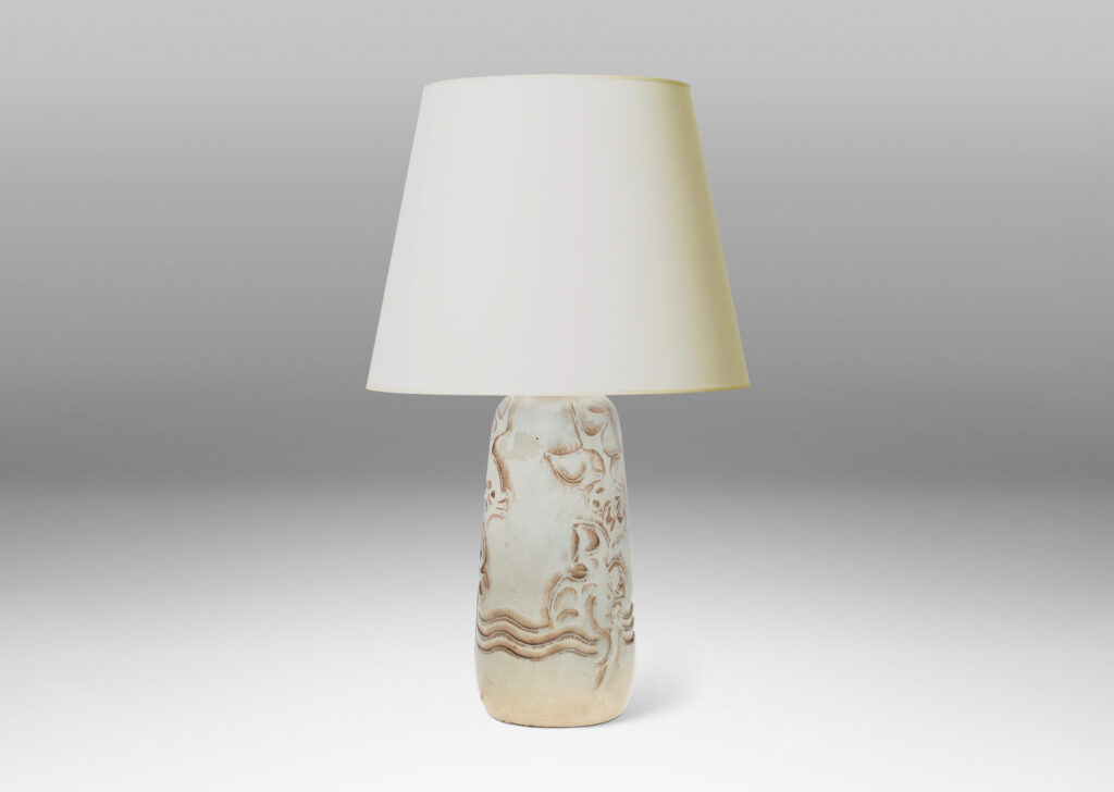 Gallery BAC upward tapering bottle-like form with dragon reliefs and carved wave design, glazed in a pale greenish gray with brown accents