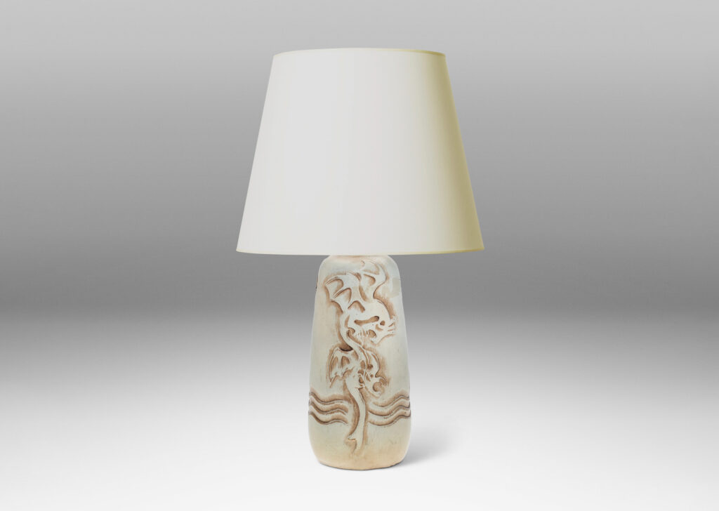 Gallery BAC upward tapering bottle-like form with dragon reliefs and carved wave design, glazed in a pale greenish gray with brown accents