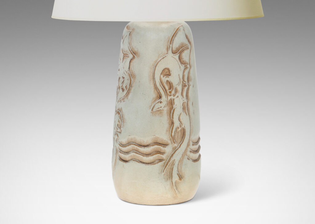 Gallery BAC upward tapering bottle-like form with dragon reliefs and carved wave design, glazed in a pale greenish gray with brown accents