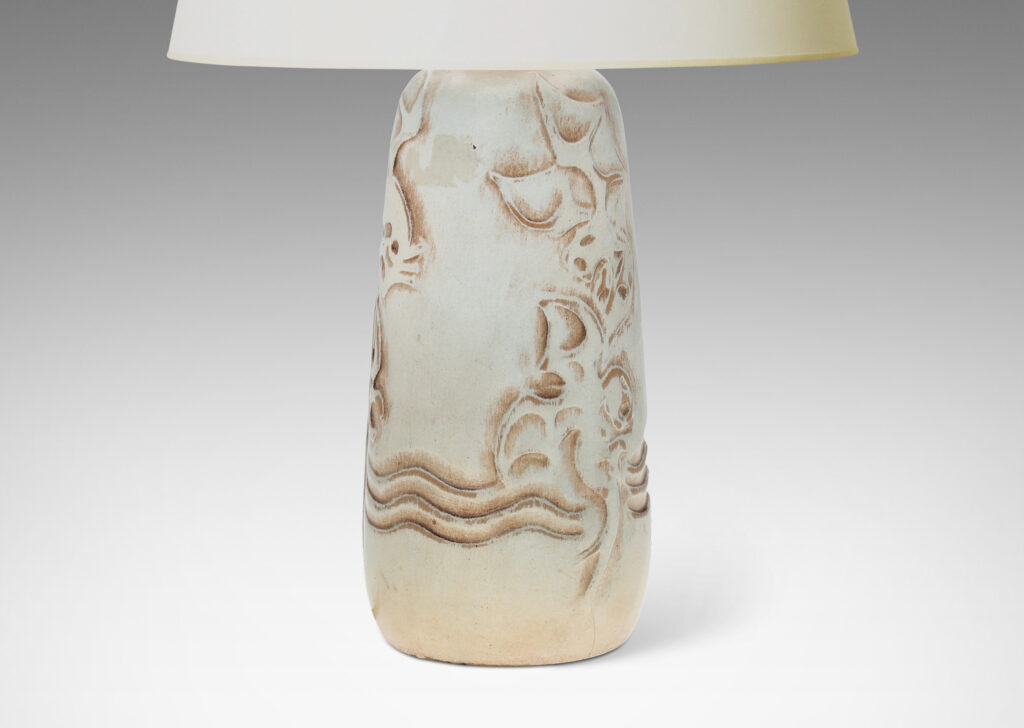 Gallery BAC upward tapering bottle-like form with dragon reliefs and carved wave design, glazed in a pale greenish gray with brown accents