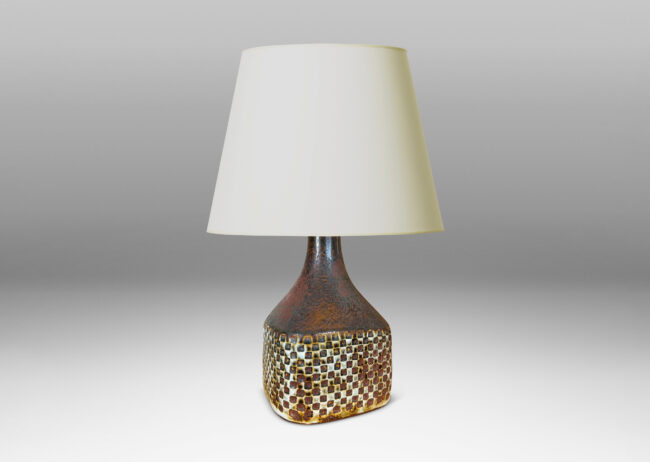 Gallery BAC square bottle-like form with checker relifs and sprouting neck, glazed in pale gray and oxblood-black