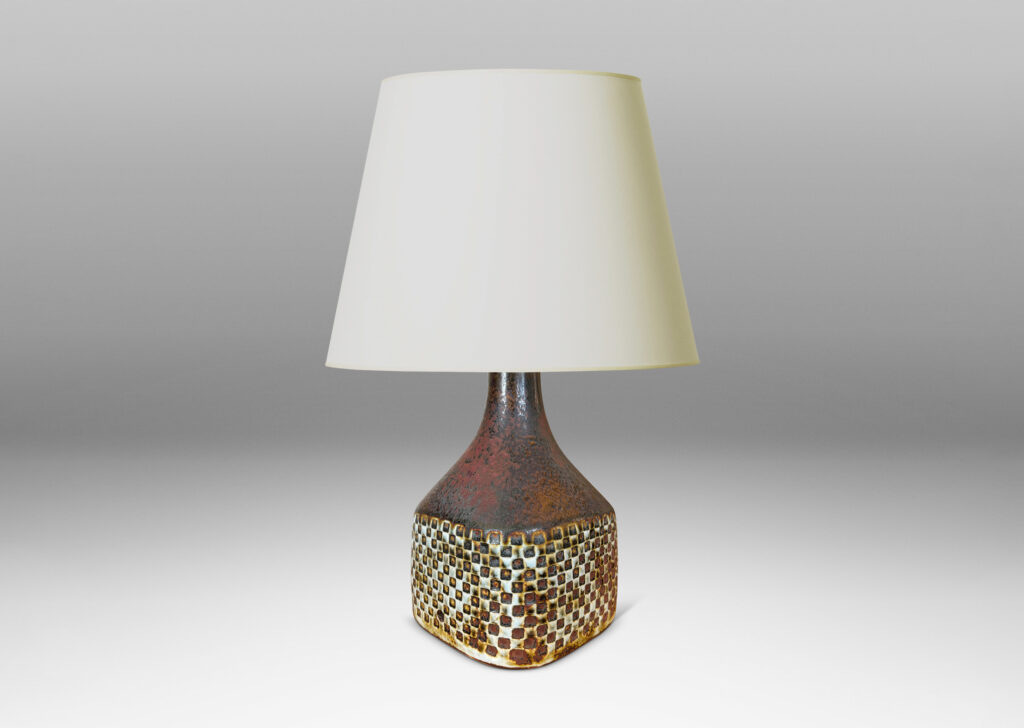 Gallery BAC square bottle-like form with checker relifs and sprouting neck, glazed in pale gray and oxblood-black