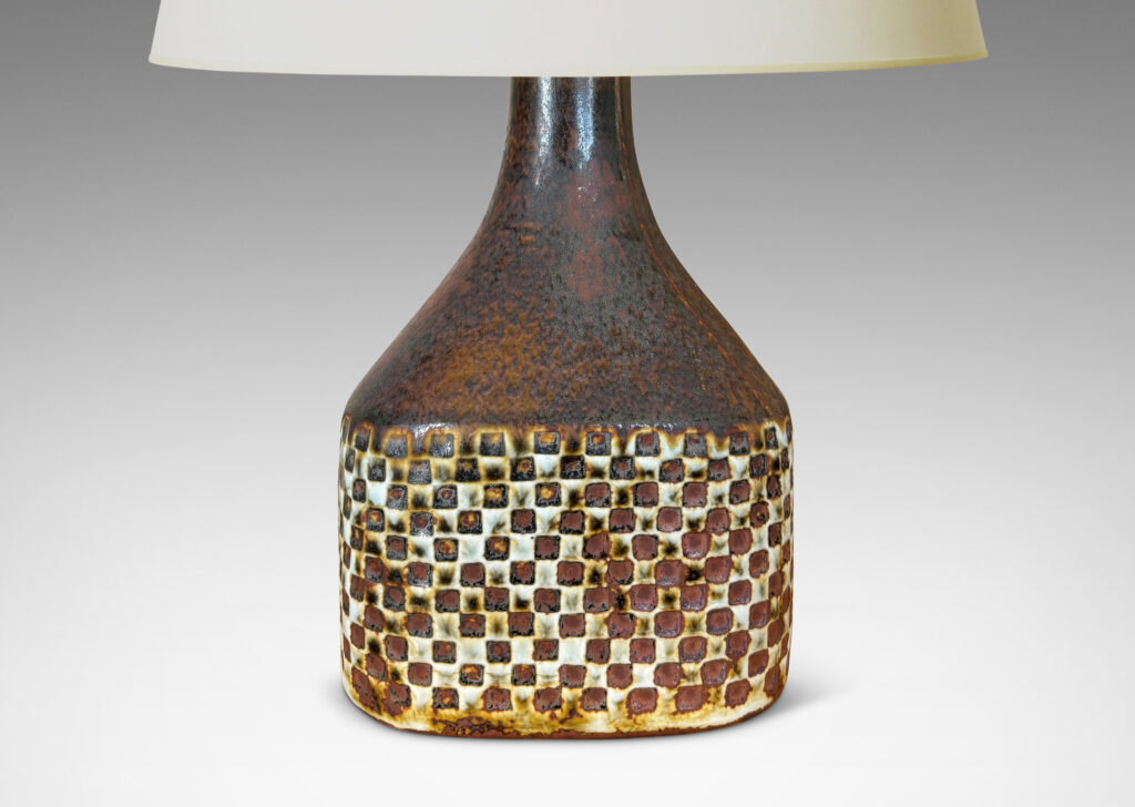 Gallery BAC square bottle-like form with checker relifs and sprouting neck, glazed in pale gray and oxblood-black