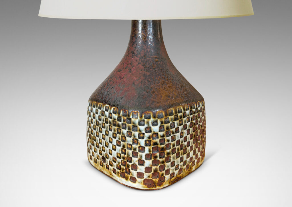 Gallery BAC square bottle-like form with checker relifs and sprouting neck, glazed in pale gray and oxblood-black