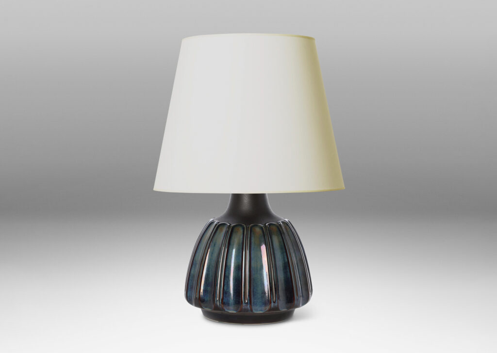 Gallery BAC large organically modeled rounded form with vertical flutes glazed in blue luster and shoulders in matte brown