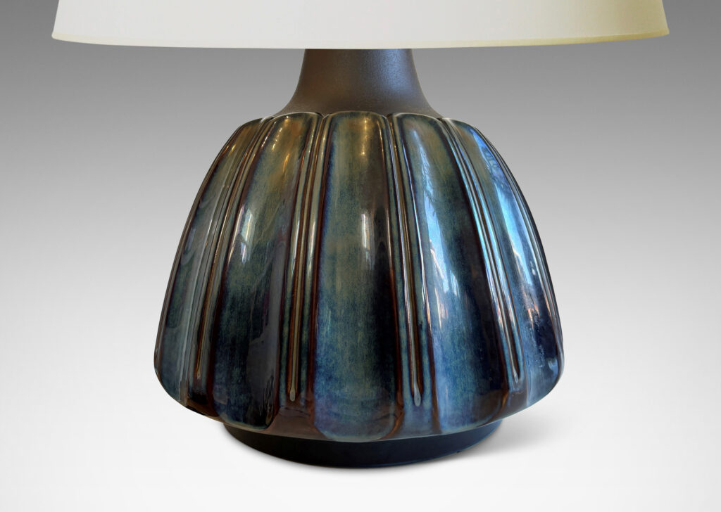 Gallery BAC large organically modeled rounded form with vertical flutes glazed in blue luster and shoulders in matte brown