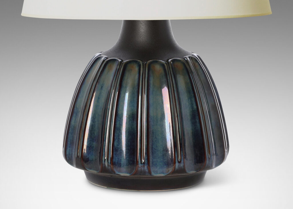 Gallery BAC large organically modeled rounded form with vertical flutes glazed in blue luster and shoulders in matte brown