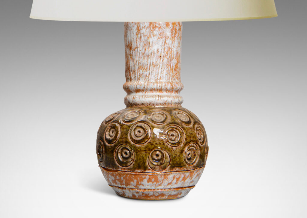 Gallery BAC globe form with carved concentric circle motifs in shiny olive green glaze, and a wide textured neck in partial white glaze