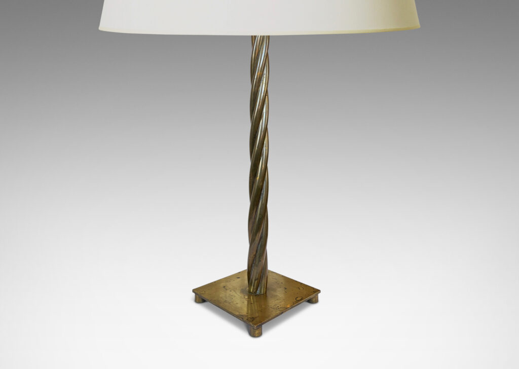 Gallery BAC twisted bundle of stands rising from a square base; brass