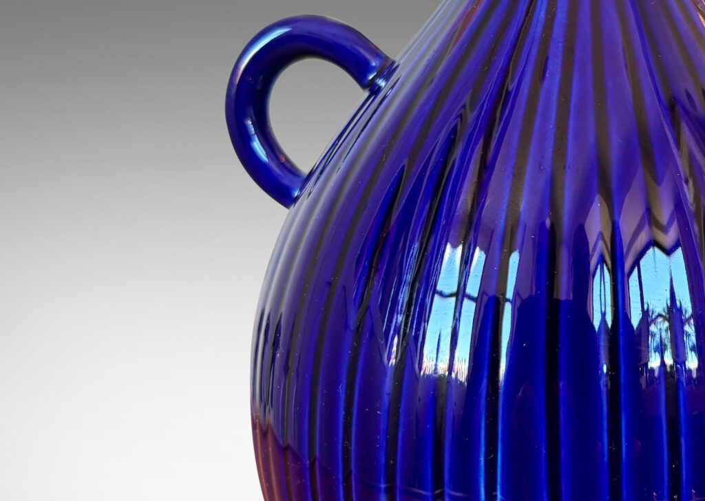 Gallery BAC reeded bulb form with handle glazed in a saturated blue