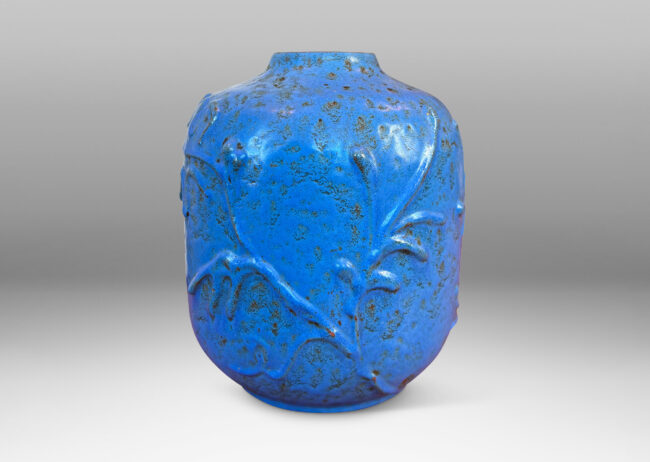 Gallery BAC straight-sided ovoid form with abstract botanical reliefs, glazed in a mottled cerulean-cornflower blue