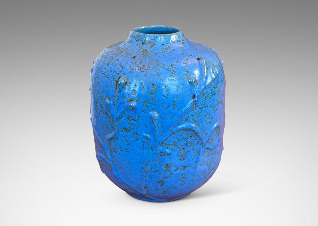 Gallery BAC straight-sided ovoid form with abstract botanical reliefs, glazed in a mottled cerulean-cornflower blue