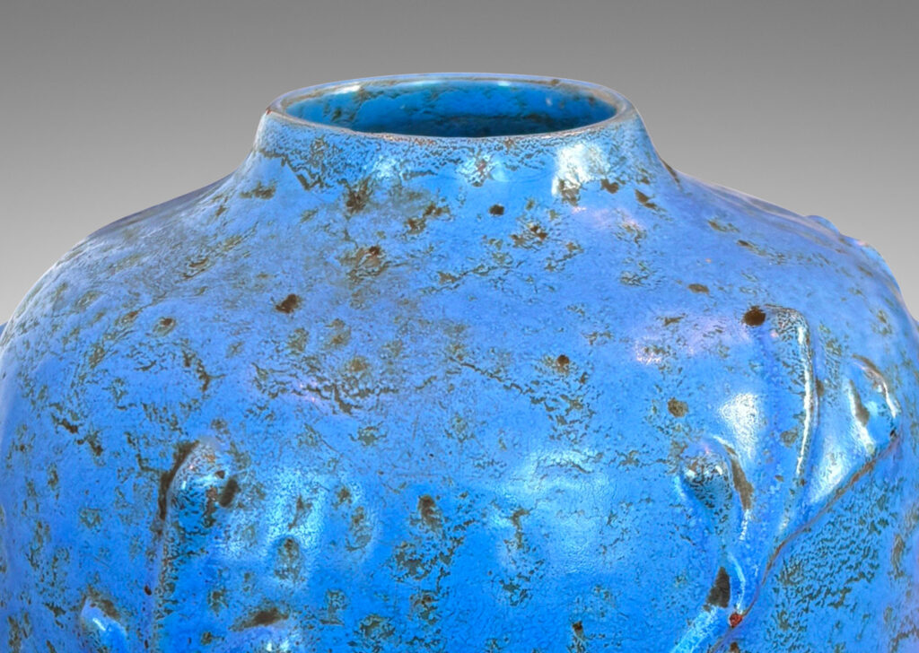 Gallery BAC straight-sided ovoid form with abstract botanical reliefs, glazed in a mottled cerulean-cornflower blue