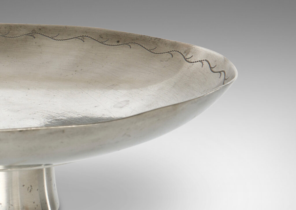 Gallery BAC wide shallow bowl with engraved foliate wave border, on an angled stand; pewter