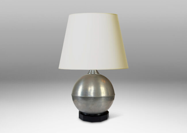 Gallery BAC arge globe form on an octagonal plinth; pewter or steel with ebonized wood