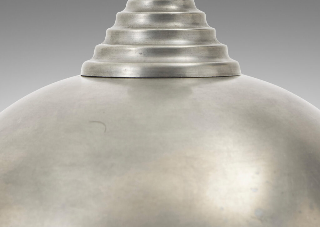 Gallery BAC arge globe form on an octagonal plinth; pewter or steel with ebonized wood