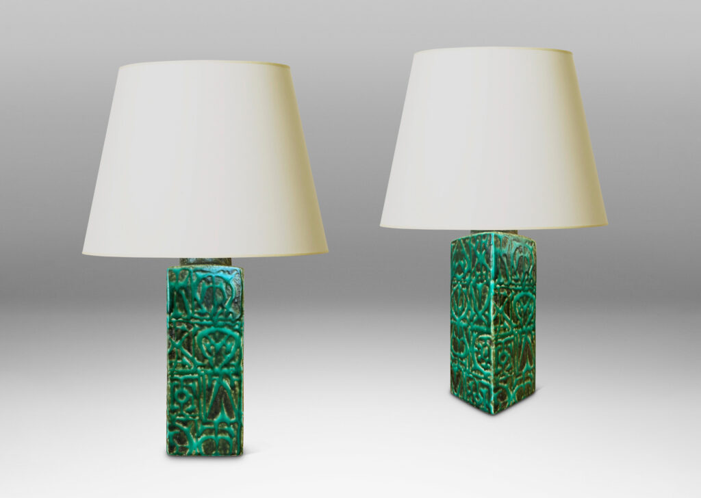 Gallery BAC square pillar forms with geometric designs in alpine green against a dark jungle green