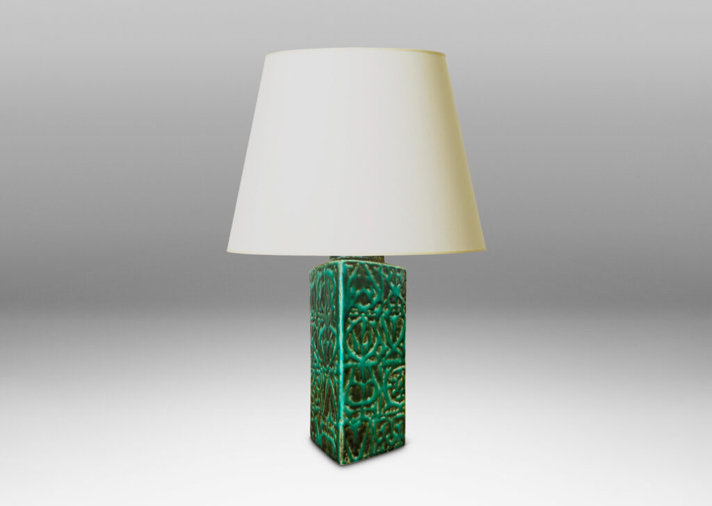 Gallery BAC square pillar forms with geometric designs in alpine green against a dark jungle green