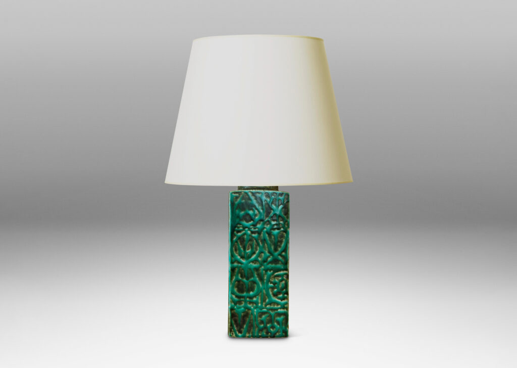 Gallery BAC square pillar forms with geometric designs in alpine green against a dark jungle green