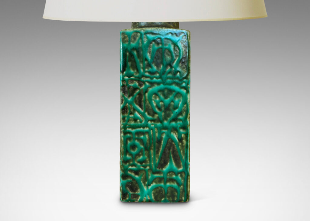 Gallery BAC square pillar forms with geometric designs in alpine green against a dark jungle green