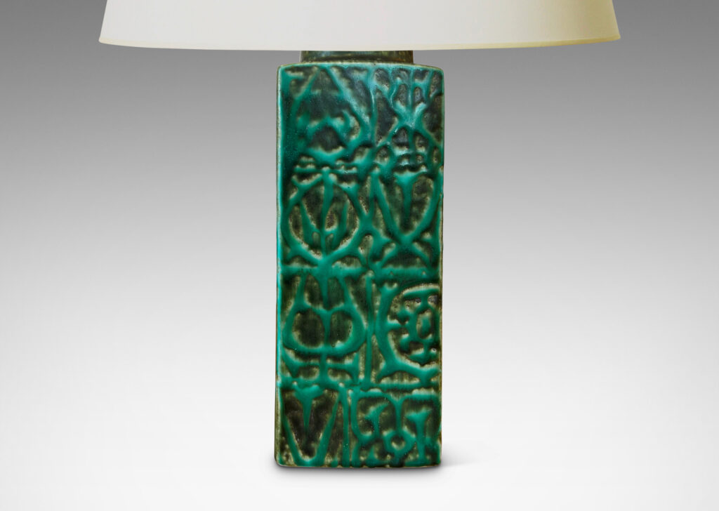 Gallery BAC square pillar forms with geometric designs in alpine green against a dark jungle green