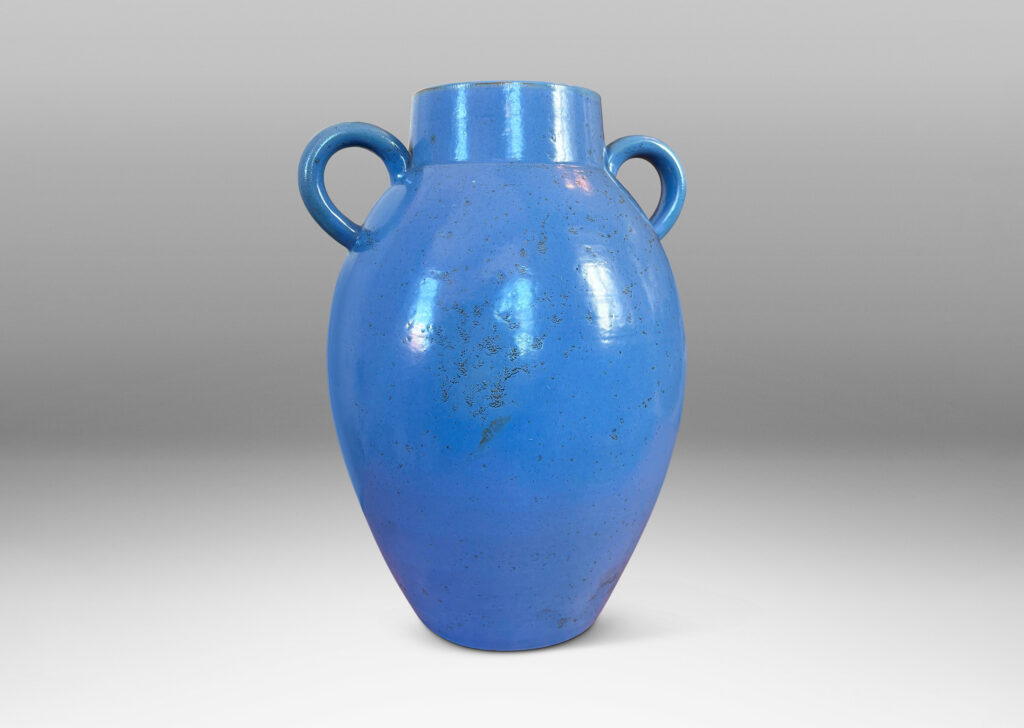 Gallery BAC tapered ovoid form with wide mouth and arc handles, glazed in a light cornflower blue