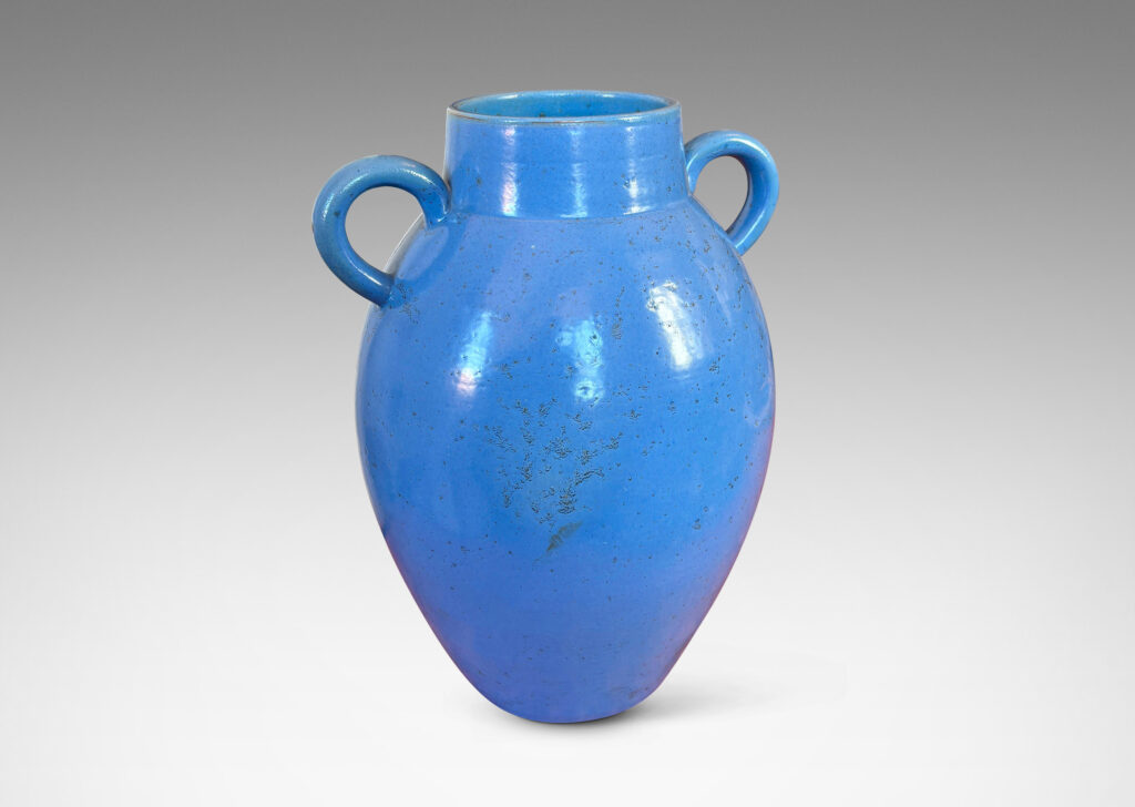 Gallery BAC tapered ovoid form with wide mouth and arc handles, glazed in a light cornflower blue
