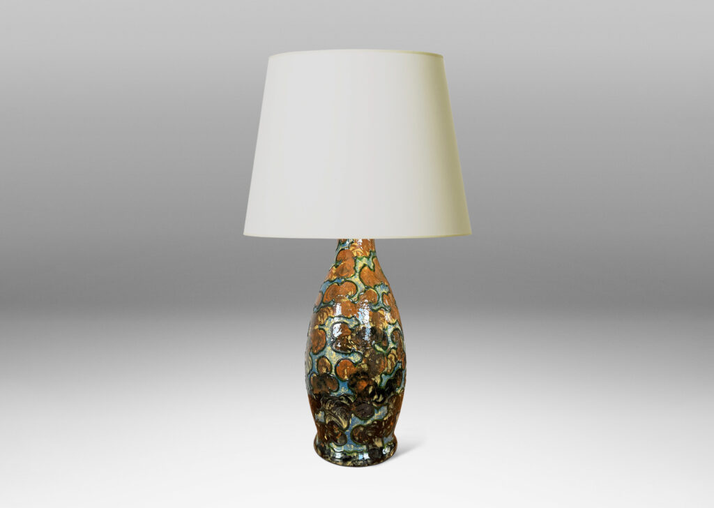 Gallery BAC undulating form with piped relief cloud-like pattern, with fields glazed in burnt orange and light blue