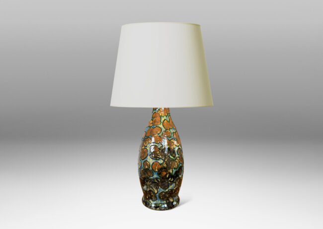 Gallery BAC undulating form with piped relief cloud-like pattern, with fields glazed in burnt orange and light blue