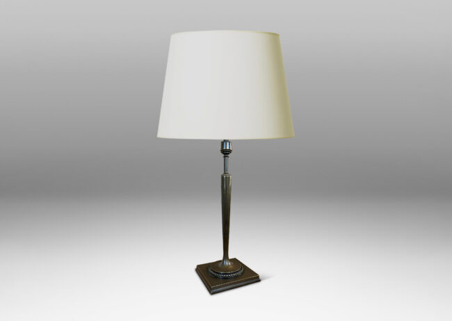 Gallery BAC torch form with tapered and fluted stand, mitered square base, and rings of beading; patinated bronze