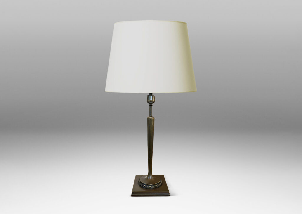 Gallery BAC torch form with tapered and fluted stand, mitered square base, and rings of beading; patinated bronze