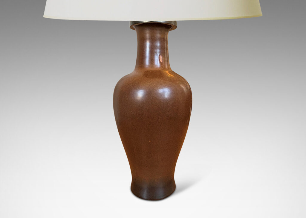 Gallery BAC void form glazed in a warm burnt sienna; stoneware