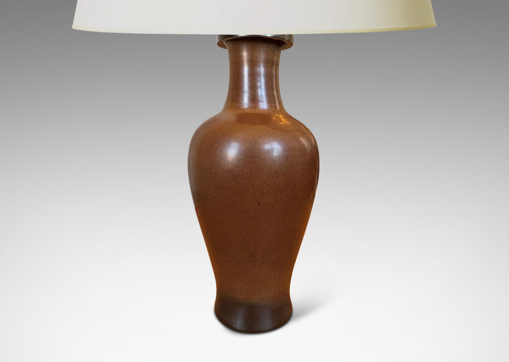 Gallery BAC void form glazed in a warm burnt sienna; stoneware