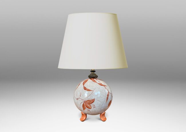 Gallery BAC globe form in white with a brown craquel, with leaf-form feet and fine hand-painted foliage in a coral-orange, and an original ornamented mount