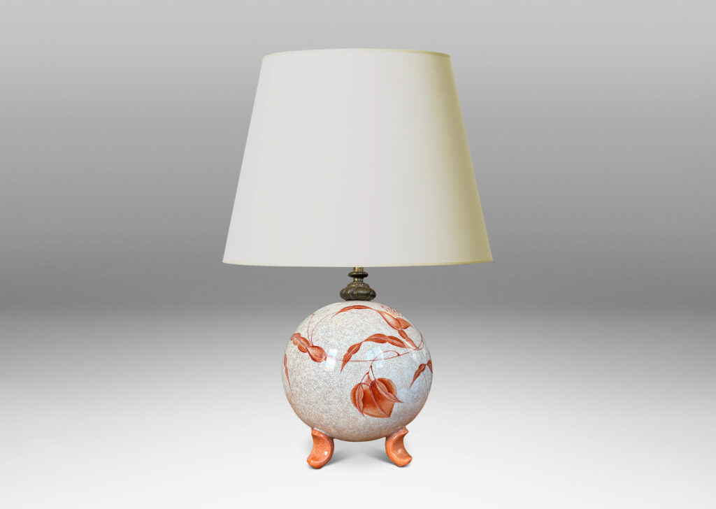 Gallery BAC globe form in white with a brown craquel, with leaf-form feet and fine hand-painted foliage in a coral-orange, and an original ornamented mount