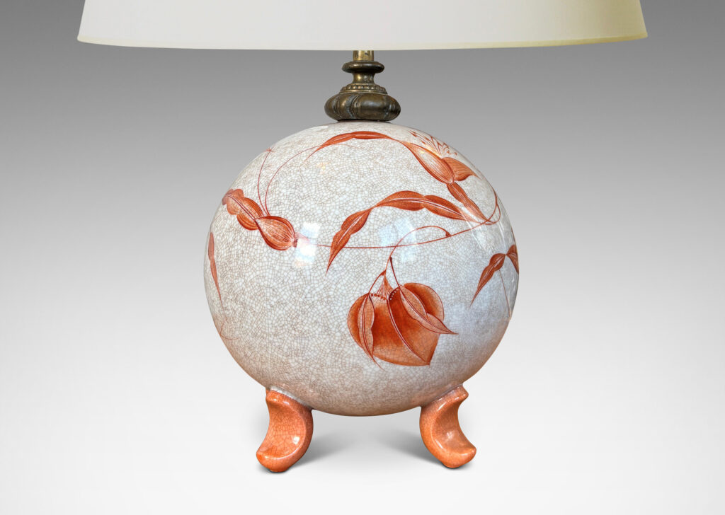 Gallery BAC globe form in white with a brown craquel, with leaf-form feet and fine hand-painted foliage in a coral-orange, and an original ornamented mount