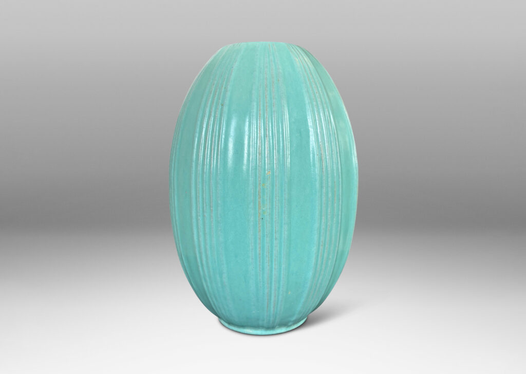 Gallery BAC ovoid form with ridged bands, glazed in a light blue-celadon tone