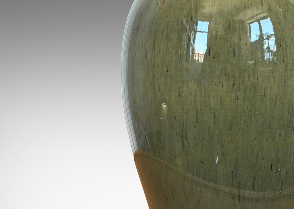 Gallery BAC tapered form with sprouting neck, glazed in a mossy green with gold-tan undertones
