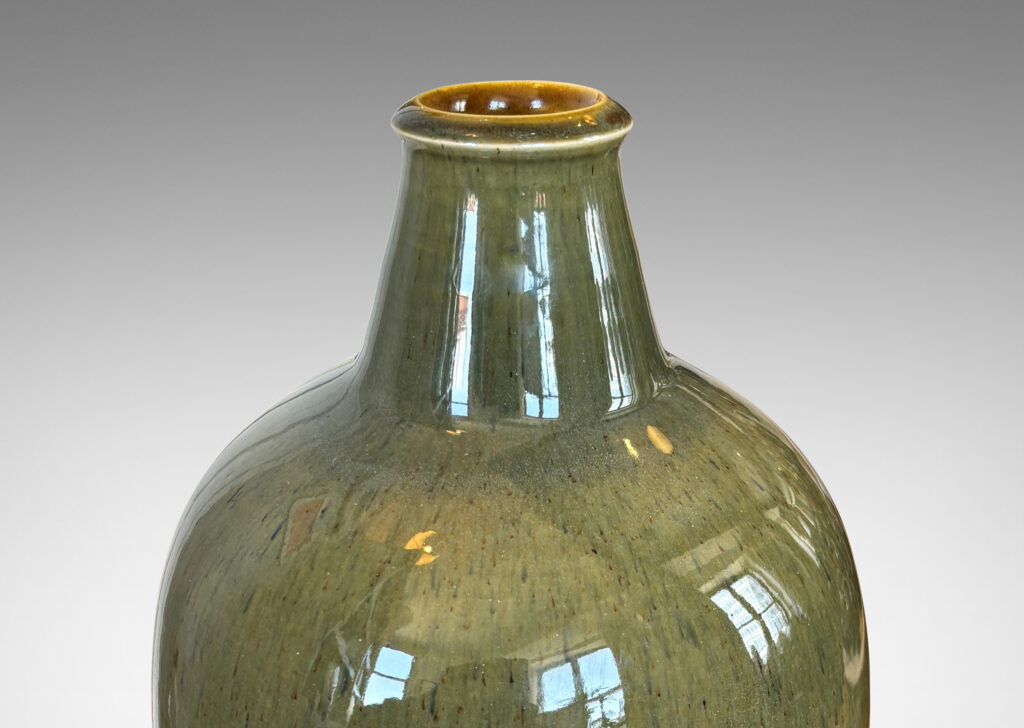 Gallery BAC tapered form with sprouting neck, glazed in a mossy green with gold-tan undertones
