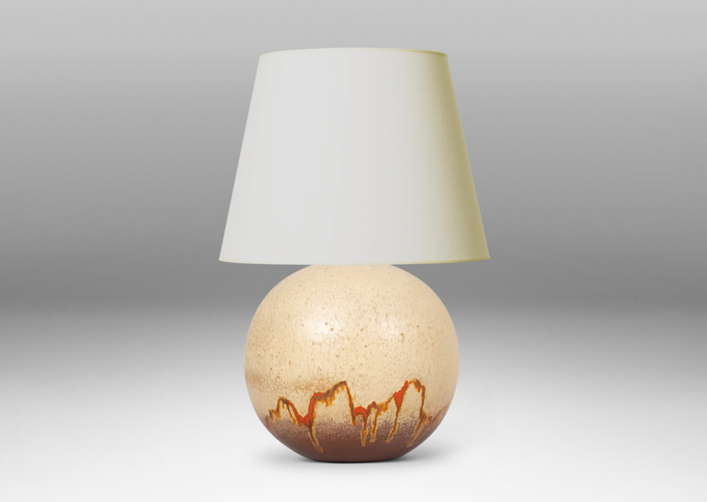 Gallery BAC globe form glazed in a pale taupe and brown, with a dripping line of orange