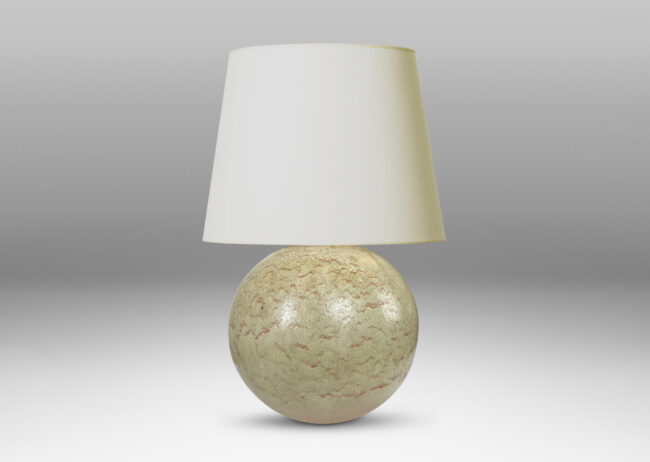 Gallery BAC globe form with a flowing pale beige and tan glaze; earthenware