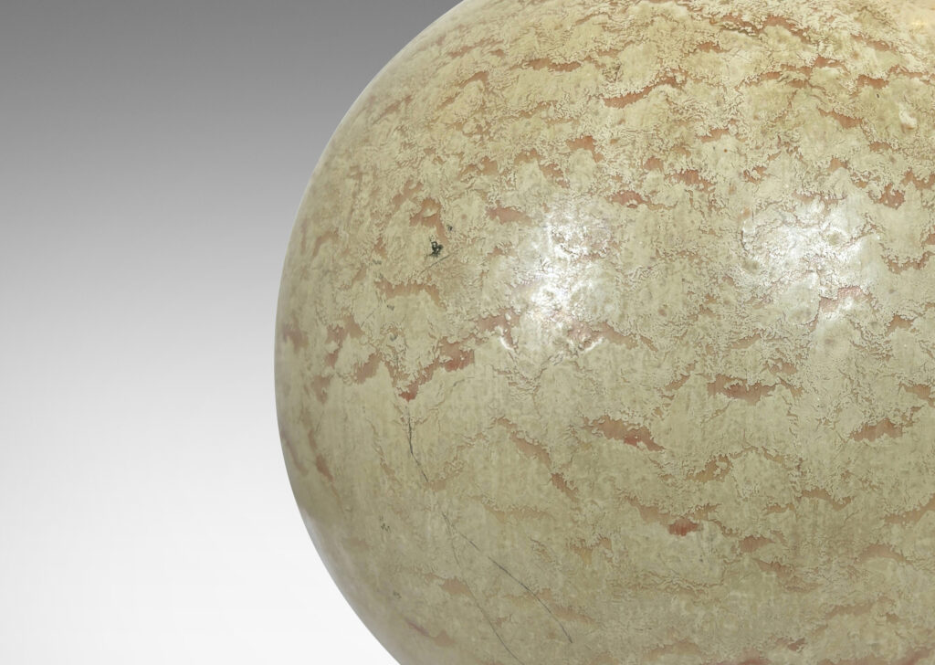 Gallery BAC globe form with a flowing pale beige and tan glaze; earthenware