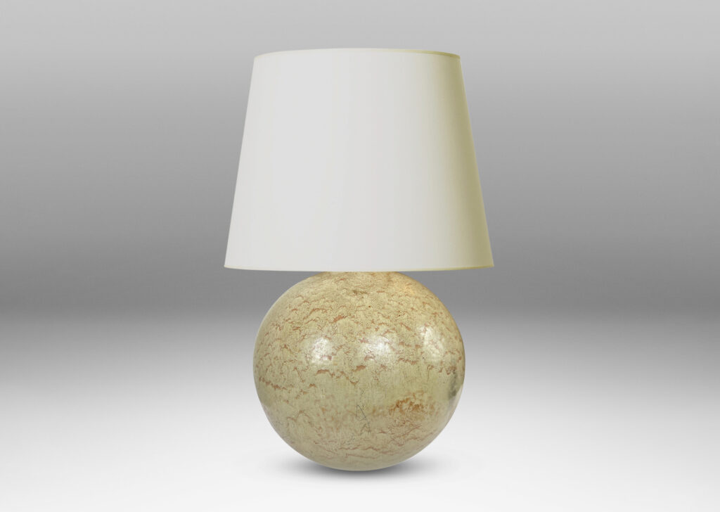 Gallery BAC globe form with a flowing pale beige and tan glaze; earthenware
