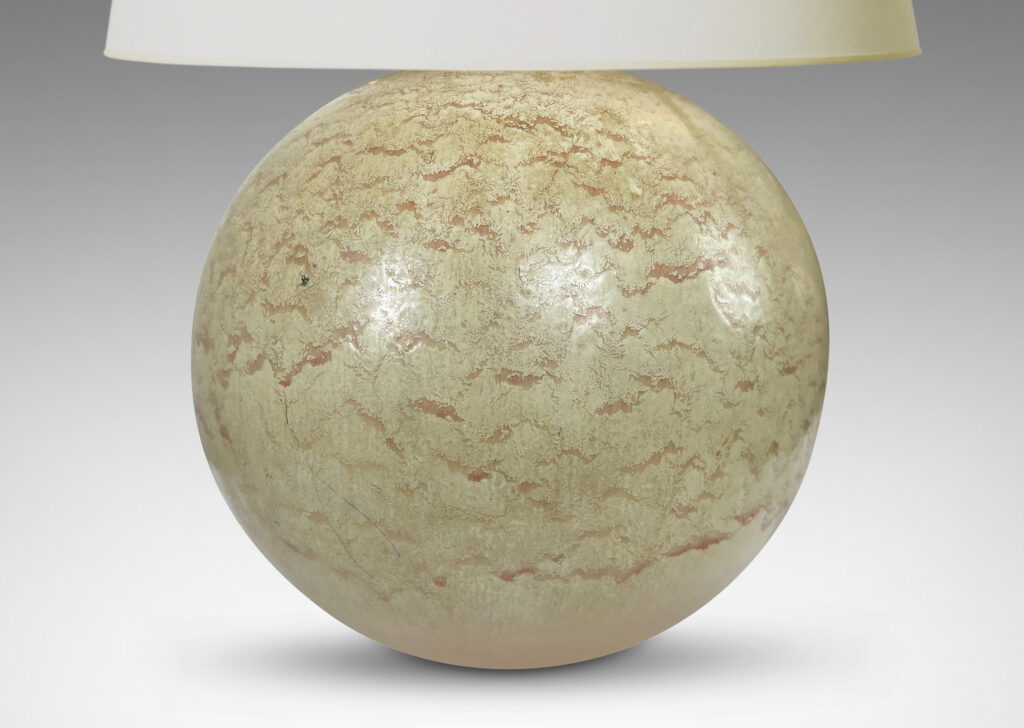Gallery BAC globe form with a flowing pale beige and tan glaze; earthenware