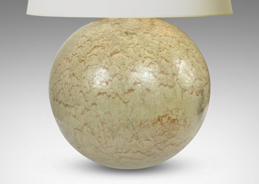 Gallery BAC globe form with a flowing pale beige and tan glaze; earthenware