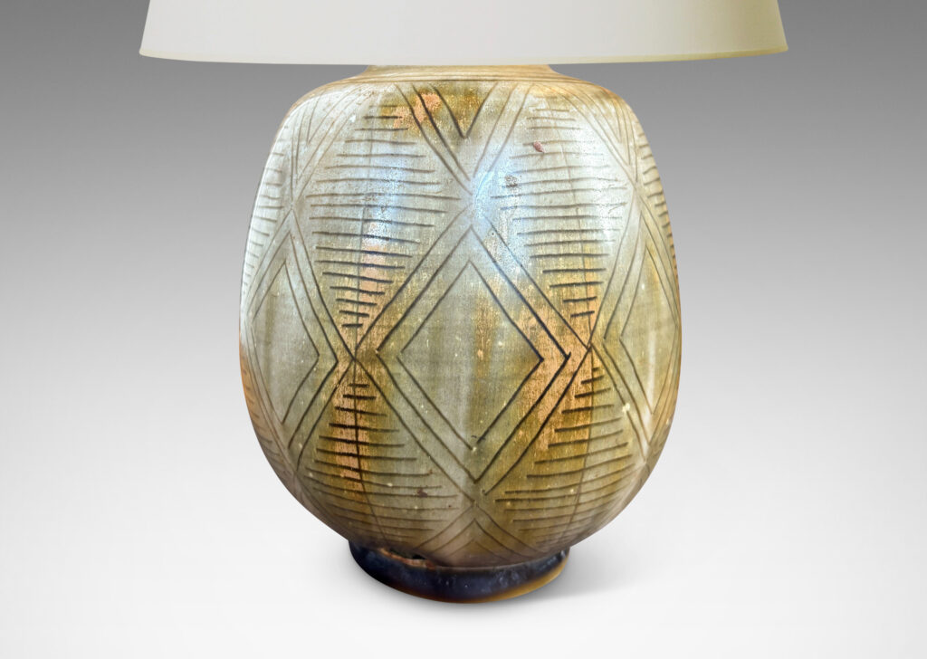 Gallery BAC swelling ovoid form carved with a diamond pattern design and gold-gray glaze wash